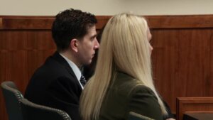 Bryan Kohberger wearing a suit sits in court