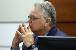 Scot Peterson sits at the defense table during his trial