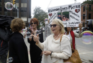 Victoria Valentino stands on the street with protesters