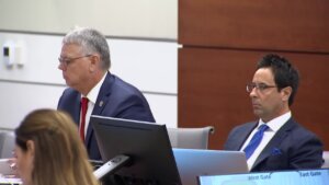 Scot R. Peterson and his attorney listen to the opening statements