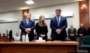 Lori Vallow Daybell stands between her attorneys in court as the verdict is read in her trial.