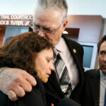 Former Marjory Stoneman Douglas High School School Resource Officer Scot Peterson with his wife and attorney.