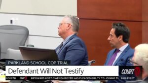 Scot Peterson sits with his attorney in court