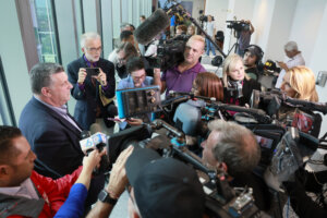 Tony Montalto, father of murder victim Gina Montalto, right, speaks with media.