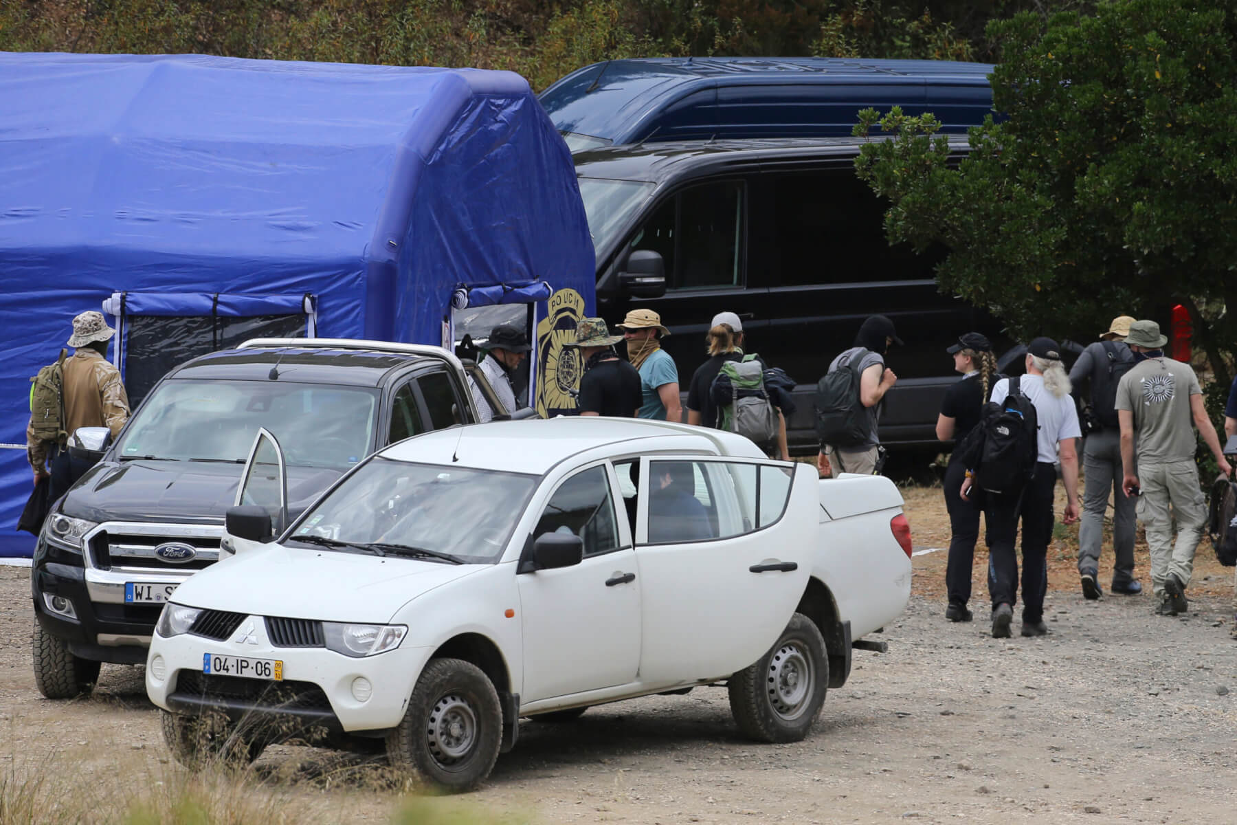 search teams arrive back to an operation tent near Barragem do Arade,