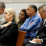 Gena and Tom Hoyer, left, and Max Schachter, right, listen during closing arguments.