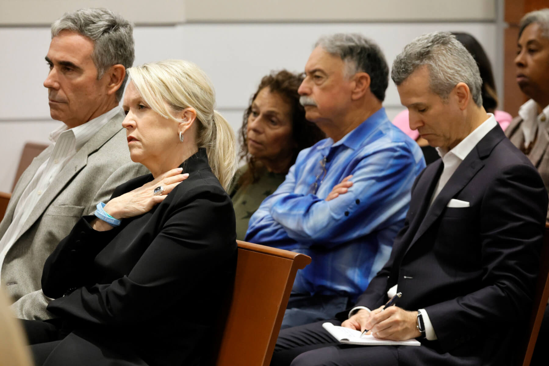 Gena and Tom Hoyer, left, and Max Schachter, right, listen during closing arguments.