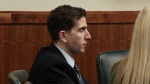 Bryan Kohberger, in a suit, sits in court