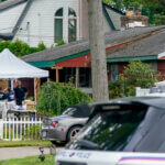 Authorities search the home of suspect Rex Heuermann.