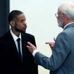 Kecalf Franklin, a son of music superstar Aretha Franklin, talks with his attorney.