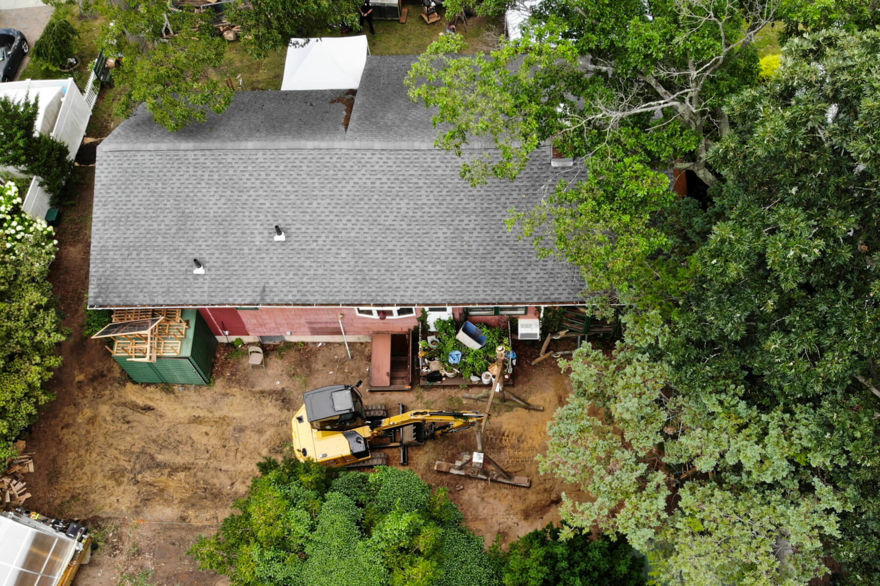 Aerial photo of excavator outside house