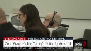 Michael Turney sits in court