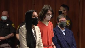 crumbley and his attorneys, wearing masks, appear in court