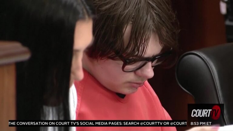 Ethan Crumbley looks down as he sits in court