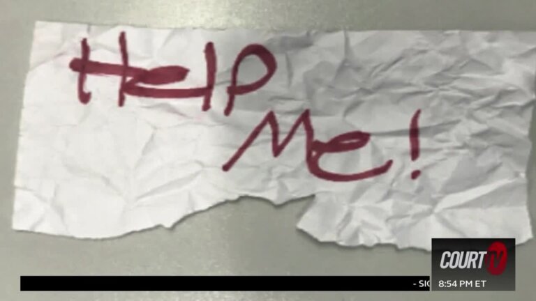 handmade sign says 'help me!' in red