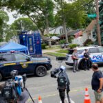 Authorities search the home of suspect Rex Heuermann.