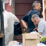 Authorities search the home of suspect Rex Heuermann.