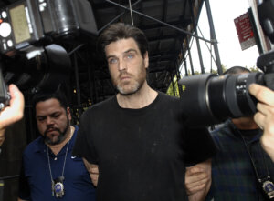 Robert Chambers is led in handcuffs into Manhattan criminal court