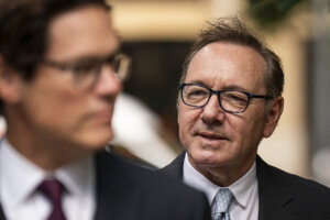 Kevin Spacey looks on as he arrives at Southwark Crown Court,