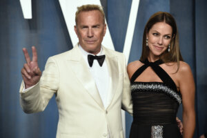 Christine Baumgartner, right, and Kevin Costner, left