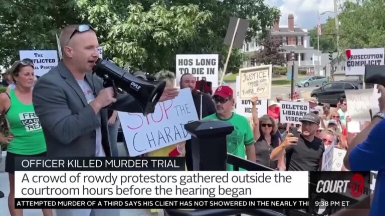 Protesters with signs and bullhorns outside of a courthouse