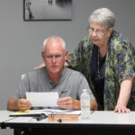 Marion, Kansas Vice Mayor Ruth Herbel, right, confers with fellow City Council member Kevin Burkholder.