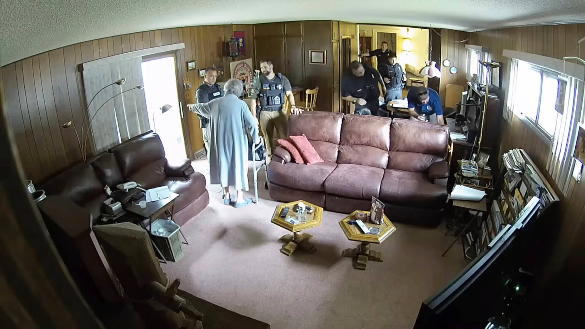 Eric Meyer's mother, Joan Meyer, orders police officers to get out of her house.