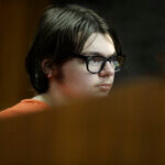 Ethan Crumbley listens to testimony from Dr. Colin King during his hearing.