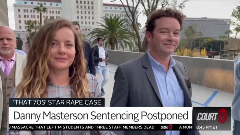 Danny Masterson walks out of court with his wife.