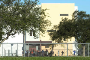 Nine members of Congress and others wait to enter Marjory Stoneman Douglas High School