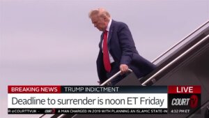 Donald trump descends stairs from a plane