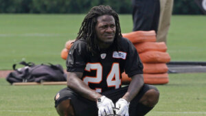 Bengals player Adam 'Pacman' jones squats in uniform