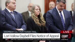 Lori Vallow Daybell stands between her attorneys in court