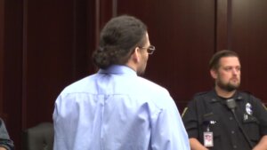 Johnathan Quiles stands in court