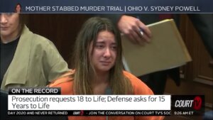 Sydney Powell cries during her sentencing