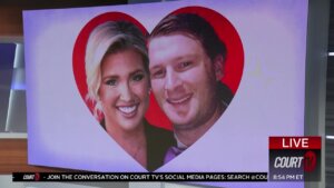 A man and woman's face appear in a red heart on a white background