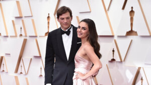 Ashton Kutcher, left, and Mila Kunis arrive at the Oscars