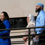 Adnan Syed walks with his mother and attorney.