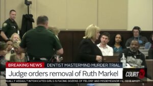 Ruth Markel is escorted out of court.