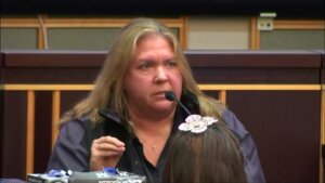 a woman testifies in court