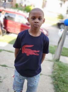 A young boy in a tshirt and jeans