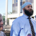 Adnan Syed walks with his mother.