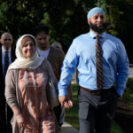 Adnan Syed walks with his mother.
