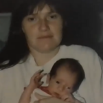 a woman holds a baby