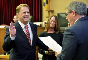 photo shows Andrew Wilkinson being sworn in as a judge