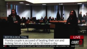 people stand inside of a courtroom