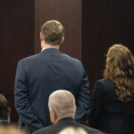 Kaitlin Armstrong stands with her attorney in court