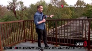 Matt Johnson stands on a bridge