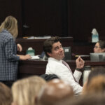 Defense attorney Geoffrey Puryear sits in court