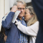 Anna Moriah Wilson's parents embrace outside of the courthouse